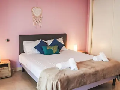 a bedroom with a bed with two towels on it at Apartment Cristal Croisette-5 by Interhome in Cannes