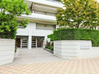 a building with two large white planters in front of it at Apartment Cristal Croisette-5 by Interhome in Cannes