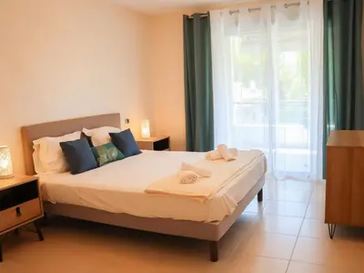a bedroom with a bed with two towels on it at Apartment Cristal Croisette-5 by Interhome in Cannes