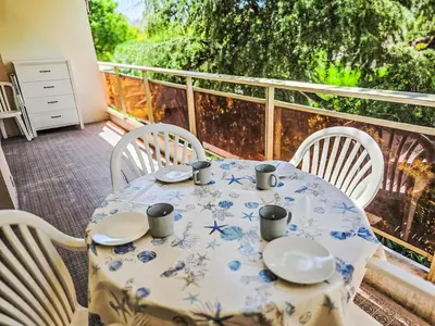a blue and white table and chairs on a balcony at Apartment Villa Lerins-8 by Interhome in Cannes