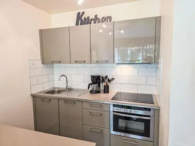 a kitchen with a sink and a stove top oven at Apartment Villa Lerins-8 by Interhome in Cannes