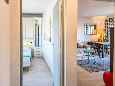 a view of a room with a bedroom and a dining room at Apartment La Chaumière by Interhome in Cannes