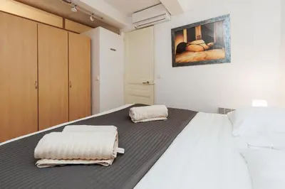 a bedroom with a bed with two towels on it at Le Meynadier Center-Festival-Clim-WiFi in Cannes