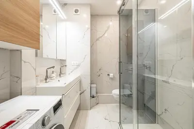 a bathroom with a shower and a toilet and a sink at LE PASTEUR pour tout confort en plein cœur de Cannes in Cannes
