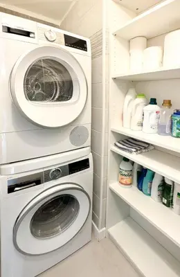 a laundry room with a washer and dryer at Elegant 2 Br with parking in Cannes