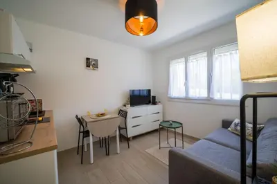 a small living room with a couch and a table at Studette Croisette, proche Martinez in Cannes