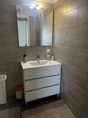 a bathroom with a sink and a mirror at 3-room apartment with sea view in Cannes in Cannes