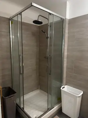 a shower with a glass door in a bathroom at 3-room apartment with sea view in Cannes in Cannes