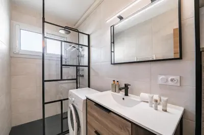 a bathroom with a sink and a shower at Studio rénové avec grande terrasse - Climatisation - Aperçu mer in Cannes