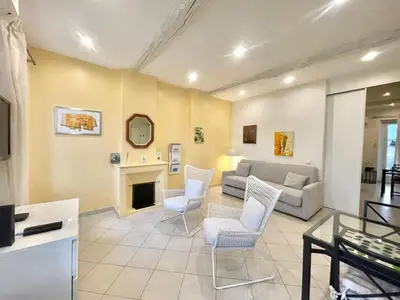 a living room with a couch and chairs and a fireplace at Mont Chevalier by Welcome to Cannes in Cannes