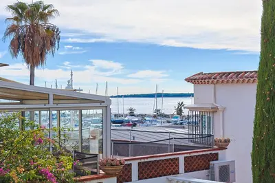 a view of a marina from the balcony of a house at Yello YourHostHelper in Cannes