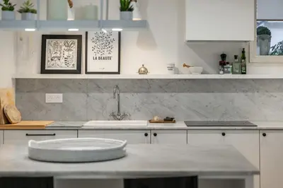 a kitchen with a sink and a counter top at Charme et confort à Cannes près de la Croisette in Cannes