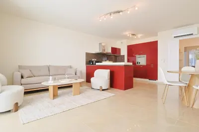 a living room with a couch and a table at Le Maria by Winsome Destination in Cannes
