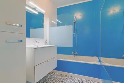 a bathroom with a shower and a sink and a tub at Le Val Joli by Winsome Destination in Cannes