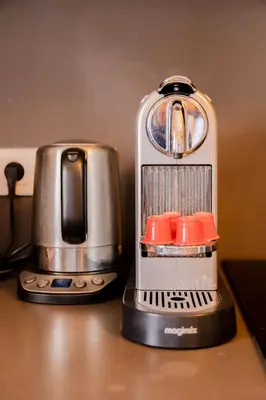 a coffee maker sitting on top of a counter at Cannes 2 pièces lumineux terrasse ensoleillée in Cannes