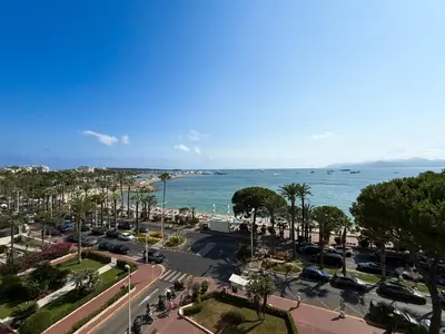 a view of a parking lot and the ocean at Sea View Apartment - Croisette in Cannes