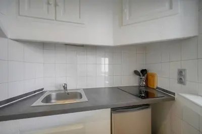 a kitchen with a sink and a counter top at Charmant 2 pièces MEYNADIER-FORVILLE A1B269 in Cannes