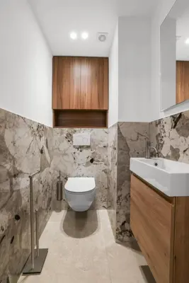 a bathroom with a toilet and a sink at REF 2006 - Cannes Croisette - Luxurious apartment with sea view for rent in Cannes