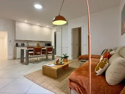 a living room with a couch and a table at Le Kallisté By SCLS Locations in Cannes