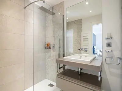 a living room with a couch and a glass table at Beautiful Apartment with Balcony 1BR 2P - Cannes in Cannes