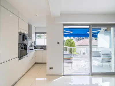 a living room with a couch and a glass table at Beautiful Apartment with Balcony 1BR 2P - Cannes in Cannes
