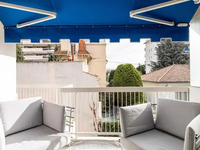 a living room with two beds and a couch at Beautiful Apartment with Balcony 1BR 2P - Cannes in Cannes