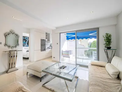 a living room with a couch and a glass table at Beautiful Apartment with Balcony 1BR 2P - Cannes in Cannes