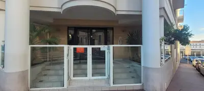 an entrance to a building with sliding glass doors at Centre Cannes Bristol in Cannes