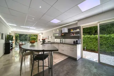 a kitchen with a table and chairs in a room at REF 1413 - Cannes Center Appartment for rent in Cannes