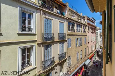 an apartment building with windows and balconies on a street at Cozy Studio Cannes 2 min Croisette & Palais 3 in Cannes