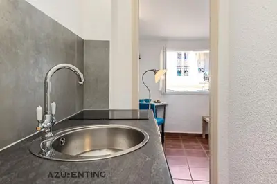 a kitchen with a sink in a room at Cozy Studio Cannes Plage Croisette 4 in Cannes