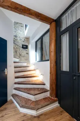 a staircase in a house with wooden beams at NEW Le Backstage Croisette et Plages à 5 min Cannes Lifestyle Central Stay OFFRE SPECIALE in Cannes