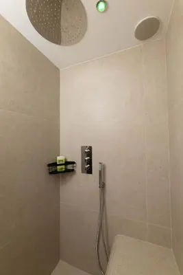 a bathroom with a shower with a shower head at NEW Le Backstage Croisette et Plages à 5 min Cannes Lifestyle Central Stay OFFRE SPECIALE in Cannes