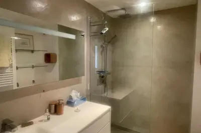 a bathroom with a shower and a sink and a shower at Escape in Cannes sea view and shared pool! in Cannes