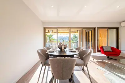 a dining room with a table and chairs at Beautiful 2-Br Apartment Sea View Beaches Within Walking Distance in Cannes