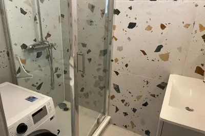 a bathroom with a shower and a sink at Apartment for 2 with balcony near beach in Cannes
