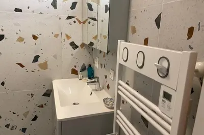 a bathroom with a sink and a mirror at Apartment for 2 with balcony near beach in Cannes