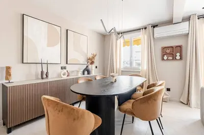 a dining room with a table and chairs at LX169 Design lumineux a deux pas de la Croisette in Cannes