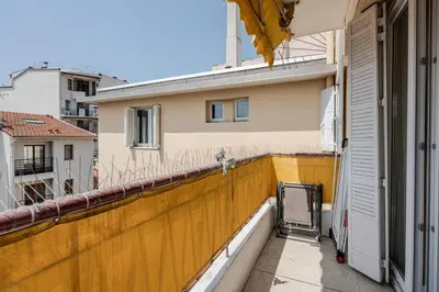 a view of a balcony with a yellow wall at LX169 Design lumineux a deux pas de la Croisette in Cannes
