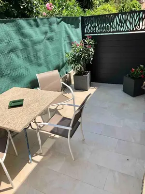 a table and chairs sitting on a patio at Charming 38m2 city house in Le Cannet