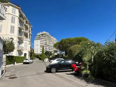 a car parked in a parking lot next to a building at Grande studio, Vue mer magnifique in Cannes