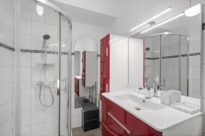 a bathroom with a sink and a shower and a mirror at Studio in Cannes city center with terrace in Cannes