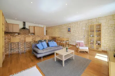a living room with a couch and a table at Spacieux 2 chambres BALCON, FELIX FAURE-COEUR DE CANNES A2B023 in Cannes