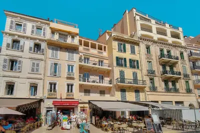 a group of people sitting in front of a building at Spacieux 2 chambres BALCON, FELIX FAURE-COEUR DE CANNES A2B023 in Cannes