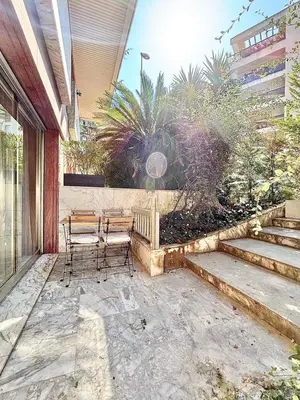 a patio with two chairs and a table at Cannes 2 bedrooms Apartment - MAD 20 in Cannes