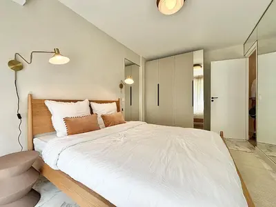 a bedroom with a large bed with white sheets at Cannes 2 bedrooms Apartment - MAD 20 in Cannes