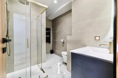 a bathroom with a shower and a sink and a toilet at Les Lucioles 1 - Luxury 1 Bedroom Apartment in Cannes