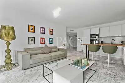 a living room with a couch and a table at REF 2014 - Cannes center - Apartment to rent in Cannes