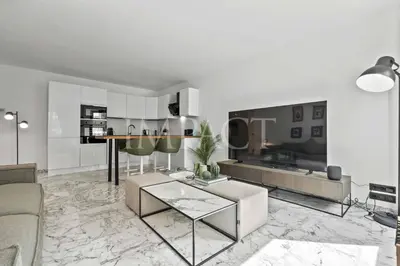 a living room with a couch and a table at REF 2014 - Cannes center - Apartment to rent in Cannes