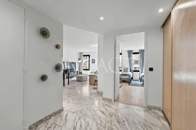a living room with white walls and a marble floor at REF 2014 - Cannes center - Apartment to rent in Cannes